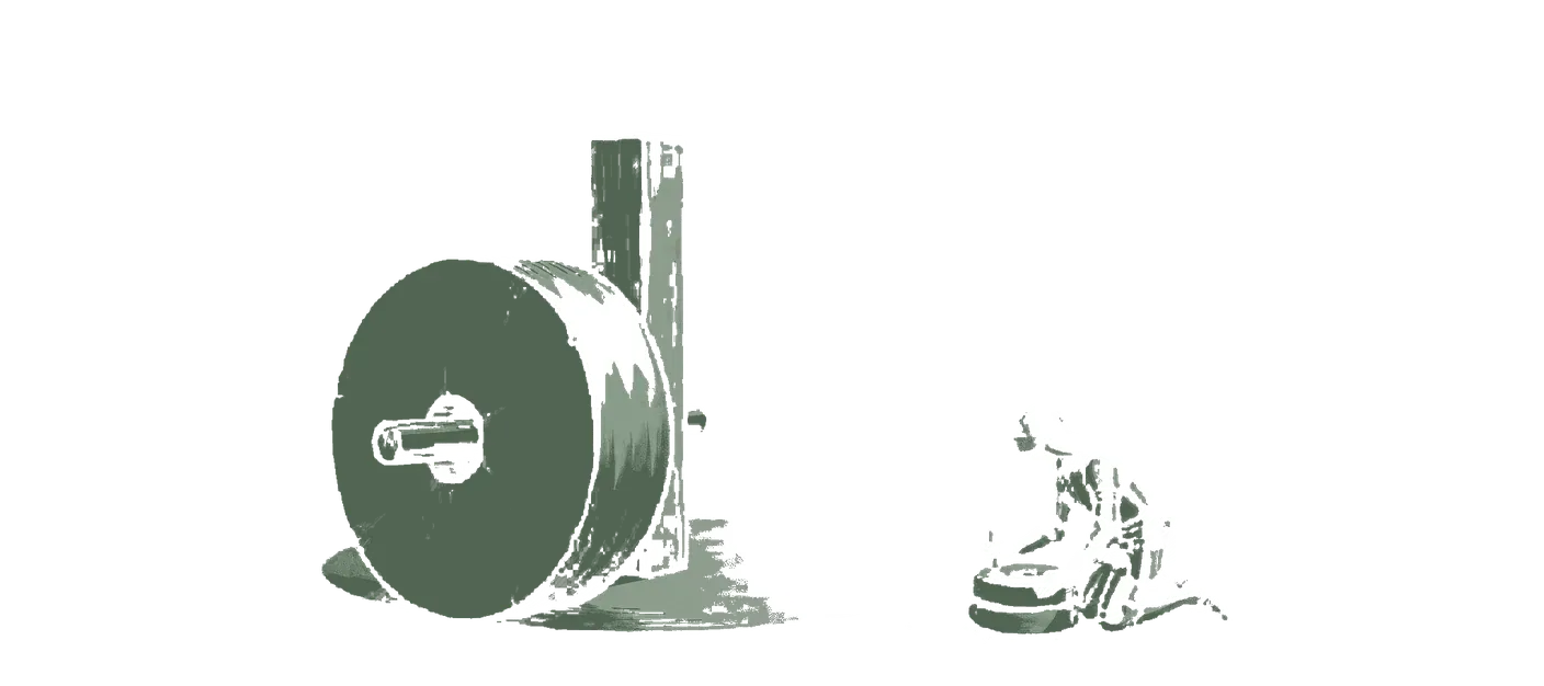 Woodblock print: inside a mill, the great millstone turning on its upright wooden shaft, and beside it on the floor the knight in plain plate armour with no heraldry or crosses working a small hand quern that must be turned once for every single grain; the quern in green. No sails indoors.